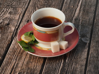 Tea cup with sugar and mint