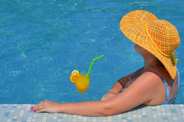 Real female beauty relaxing in swimming pool
