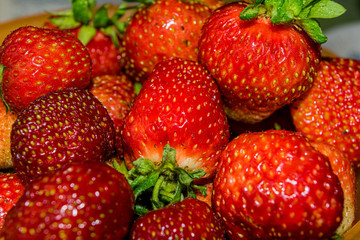 Large, beautiful, bright red and delicious strawberries.
