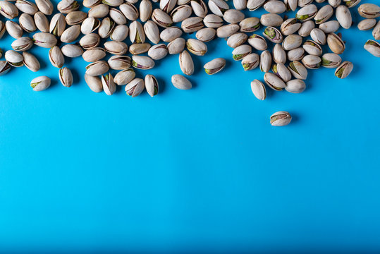  group of pistachios on a blue background