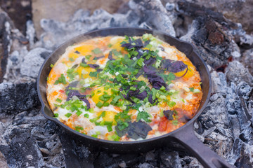 scrambled eggs cooked on charcoal