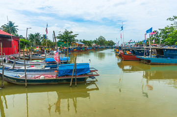 JOHORE, MALAYSIA - 21 DECEMBER 2013 : Boats park at Pantai Leka Jetty, Johore. Pantai Leka jetty is...