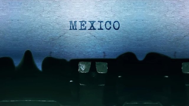 Mexico Word closeup Being Typing and Centered on a Sheet of paper on old vintage Typewriter mechanical 4k Footage Background Animation.