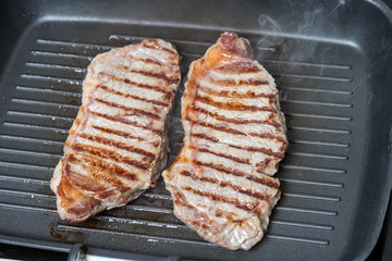pan-fried beef steak. brown crust on the meat.
