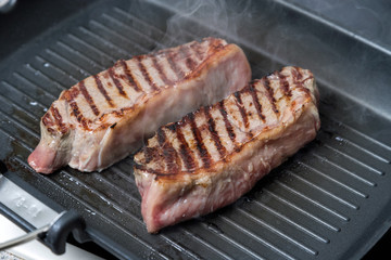 pan-fried beef steak. brown crust on the meat.