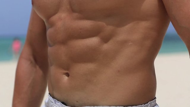 a man shows his beautiful abs