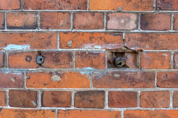 Fototapeta premium Very old wooden dowels in a brick wall