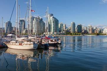 Fototapeta na wymiar Vancouver BC.skyline & False Creek river and sailboats.