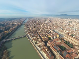 Obraz premium Aerial panorama of Florence at sunrise, Firenze, Tuscany, Italy, cathedral, river, drone pint view, mountains is on background