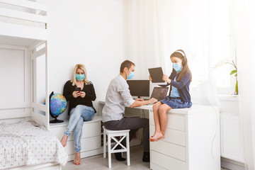 Learning at home, online learning, self quarantine concept. Family at home. Children doing homework...