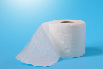 Toilet paper or tissue isolated on blue background.