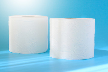 Toilet paper or tissue isolated on blue background.