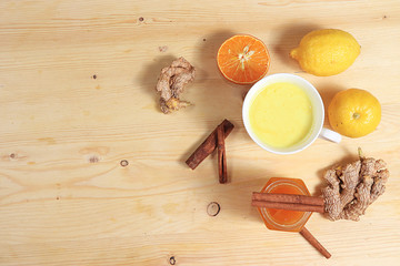 Golden turmeric latte with ginger root, cinnamon sticks, turmeric, spices for Ayurvedic medicine. The concept of alternative medicine, a means to increase immunity in a pandemic, coronovirus