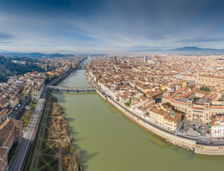 Obraz premium Aerial panorama of Florence at sunrise, Firenze, Tuscany, Italy, cathedral, river, drone pint view, mountains is on background