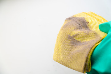 dust on a yellow rag after cleaning
