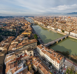 Aerial panorama of Florence at sunrise, Firenze, Tuscany, Italy, cathedral, river, drone pint view, mountains is on background