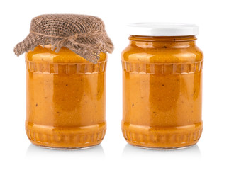 glass jar with squash caviar on white background