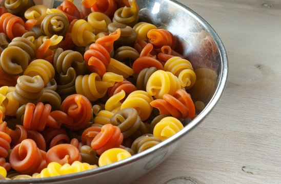 pasta insalatonde tricolore in a steel bowl