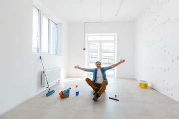 portrait of man with cleaning equipment cleaning the house