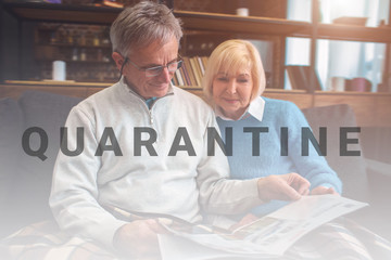 Obraz premium Beautiful old couple are sitting on the couch together and readi