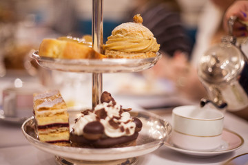 Tea and lots of beautiful cakes on the table