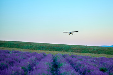 plane in the mountains at sunset