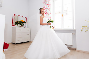 morning bride on her wedding day, blonde in white dress