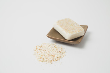 Homemade homemade oatmeal and honey soap on white background - skin care - natural beauty