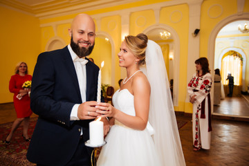 gorgeous wedding couple enjoys a Sunny day in the old town with architecture