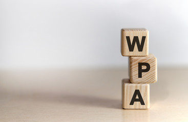 WPA - Wi-Fi Protected Access - non disclosure agreement - text on wooden cubes, on white background