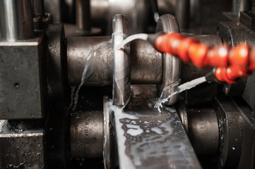 Production of metal products. Pipe forming. Close up