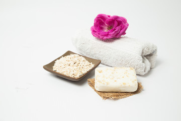 Handmade oatmeal soap on white background - organic skin care - natural spa treatments - home therapy Home spa treatment with organic oatmeal soaps - natural skin care - home therapy