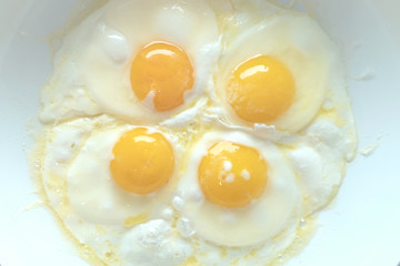 four fried eggs top view, breakfast