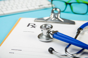 keyboard and Medical stethoscope lying on cardiogram chart closeup. Medical help, prophylaxis, disease prevention or insurance concept. Cardiology care.