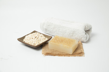 Fototapeta na wymiar 174/5000Handmade oatmeal soap on white background - organic skin care - natural spa treatments - home therapy