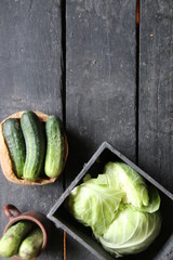 Fresh cucumbers on a old wooden kitchen table