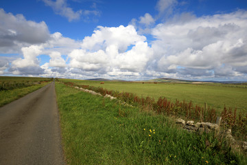 Orkney (Scotland), UK - August 09, 2018: A typical road in the Orkney islands, Orkney, Scotland, Highlands, United Kingdom