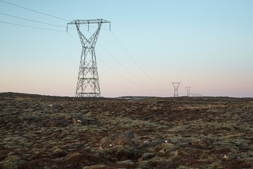 Electric lines through the rugged landscpe if Iceland
