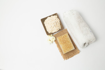 Handmade oatmeal soap on white background - organic skin care - natural spa treatments - home therapy Home spa treatment with organic oatmeal soaps - natural skin care - home therapy-top view