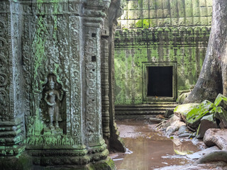 Old bas-relief and window on the ancient wall, ruins, Angkor Wat temple, Siem Reap, Cambodia