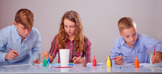 Painting courses. Group of children learning to paint. Art, creativity concept. Horizontal image.