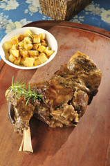 Palette of Lamb Marinated in White Wine, Herbs Served with Lamb Glace Accompanied by Potatoes