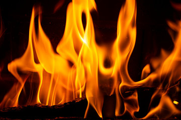 Close up on flamme burning in the fireplace