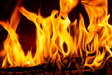 Close up on flamme burning in the fireplace
