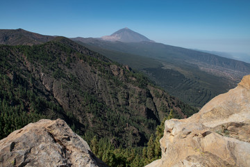 Mount Teide or Pico del Teide, the highest mountain in Spain, as seen from a viewpoint in the National Park, on TF-24 road heading up from the eastern part of the island, in Tenerife, Canary Islands