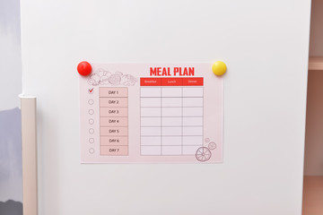 Empty meal plan on fridge in kitchen