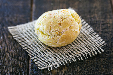 cheese bread alone, on rustic wooden background. Typical Brazilian food, made at home.
