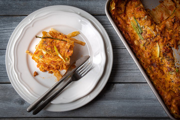 Lasagna slice on white plate