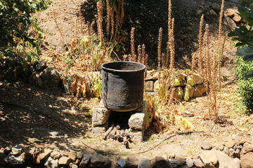 Old traditional and sooty cauldron ready to cook in a village in Chania in Crete Island, Greece. 