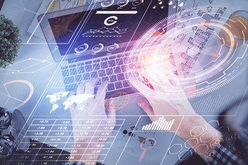 Double exposure of man's hands typing over computer keyboard and data theme hologram drawing. Top view. Technology concept.